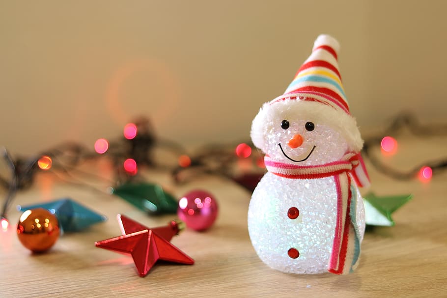 light up snowman doll with holiday ornaments
